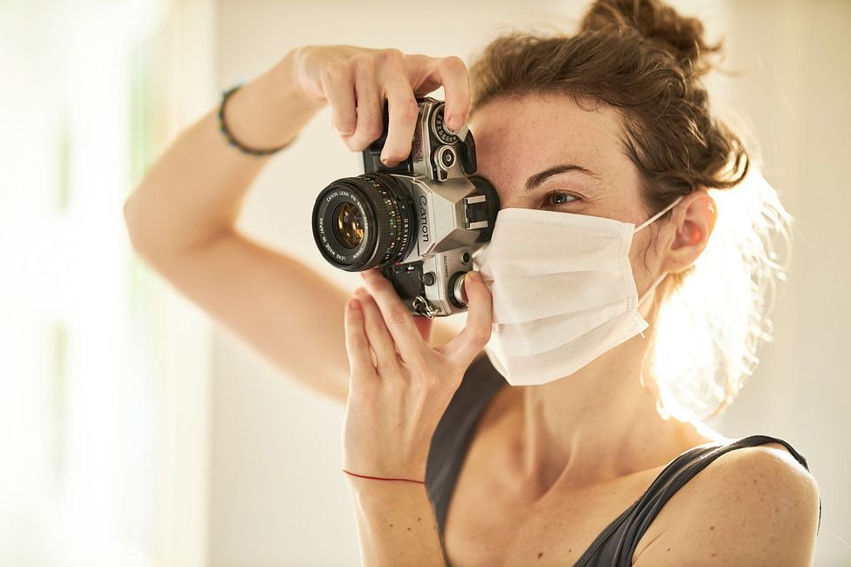 photographer in mask