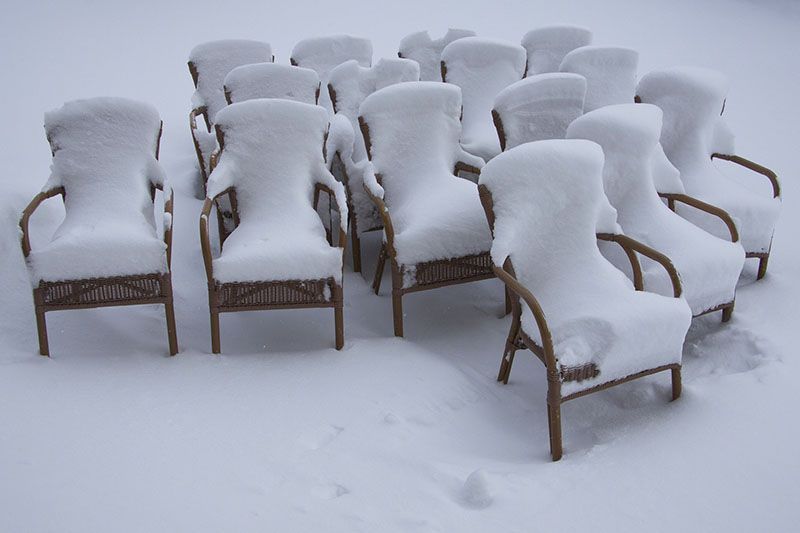 chairs covered in snow